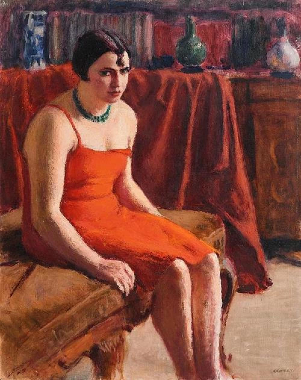 Donna seduta in un vestito rosso